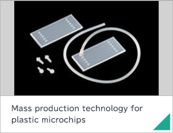Mass production technology for plastic microchips